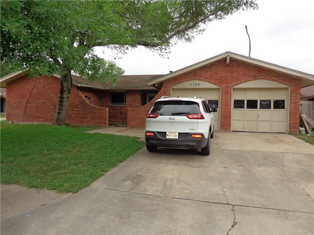 single story home with a front lawn and a garage