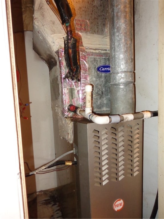 utility room with heating unit