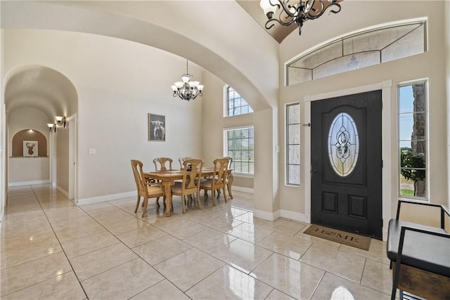3941 Cobb Ln, Robstown, TX 78380 - foyer entrance with a chandelier, arched walkways, baseboards, and a high ceiling