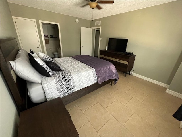 715 S Upper Broadway St Unit 202, Corpus Christi, TX 78401 - bedroom with a textured ceiling, light tile patterned floors, and a ceiling fan