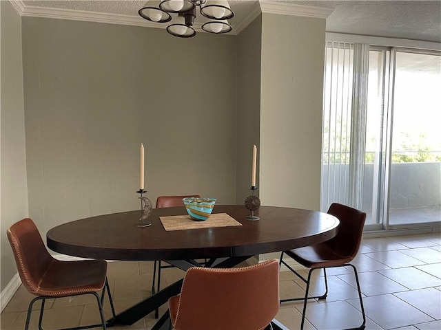 715 S Upper Broadway St Unit 202, Corpus Christi, TX 78401 - dining area with plenty of natural light, a chandelier, a textured ceiling, ornamental molding, and light tile patterned flooring