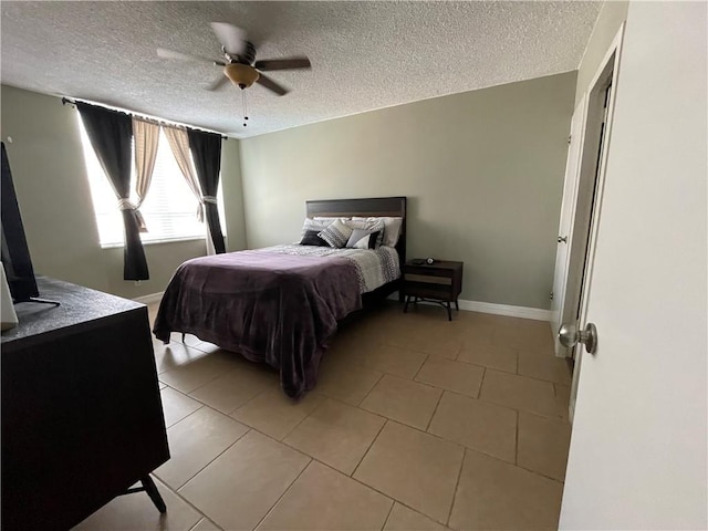 715 S Upper Broadway St Unit 202, Corpus Christi, TX 78401 - bedroom featuring a textured ceiling, light tile patterned floors, and a ceiling fan