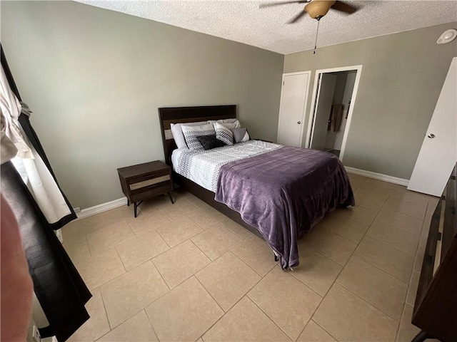 715 S Upper Broadway St Unit 202, Corpus Christi, TX 78401 - bedroom featuring a textured ceiling, light tile patterned floors, and ceiling fan