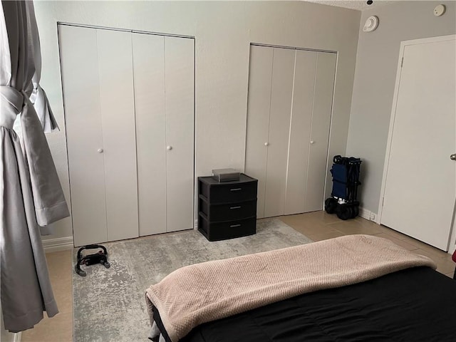 715 S Upper Broadway St Unit 202, Corpus Christi, TX 78401 - bedroom with two closets and light tile patterned floors