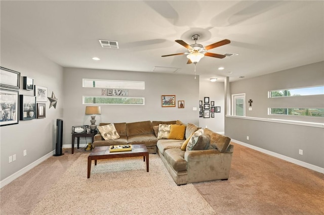 living room featuring recessed lighting, visible vents, light carpet, and baseboards