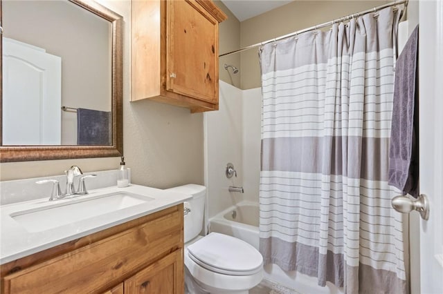 bathroom featuring toilet, shower / bath combo, and vanity