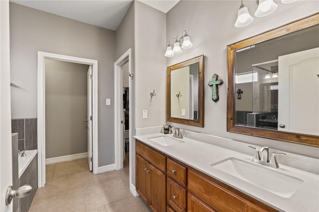 full bathroom with tile patterned flooring, a sink, a bath, and double vanity