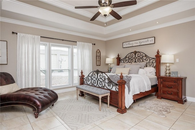 bedroom with ornamental molding, light tile patterned flooring, a raised ceiling, and a ceiling fan