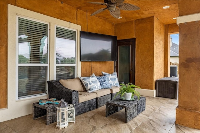 view of patio / terrace featuring ceiling fan and an outdoor living space