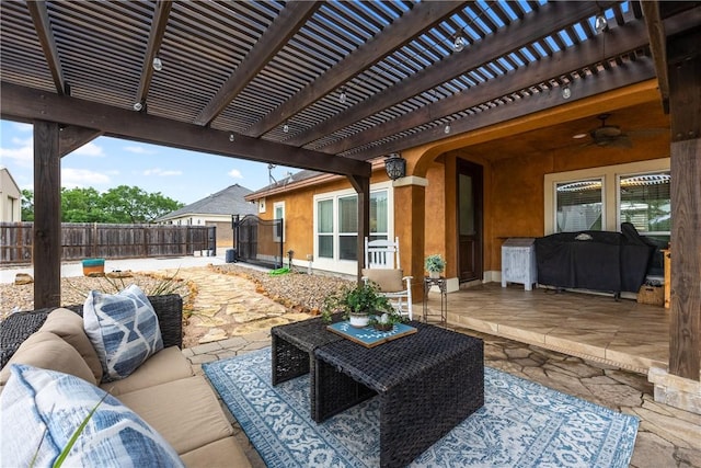 view of patio / terrace with a grill, fence, an outdoor living space, and a pergola