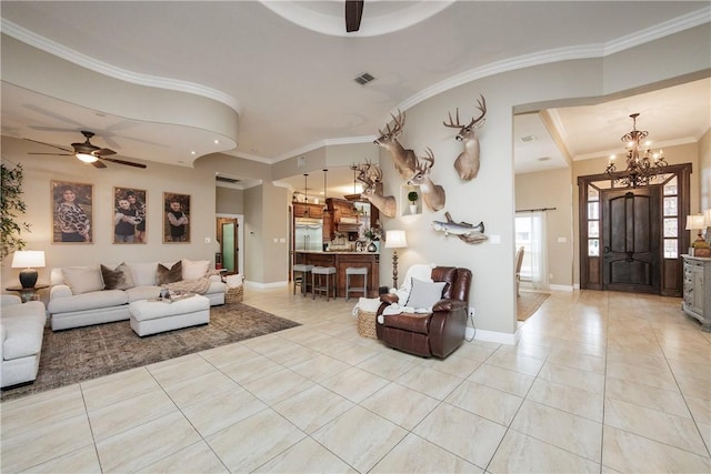 living room featuring light tile patterned floors, baseboards, visible vents, crown molding, and ceiling fan with notable chandelier