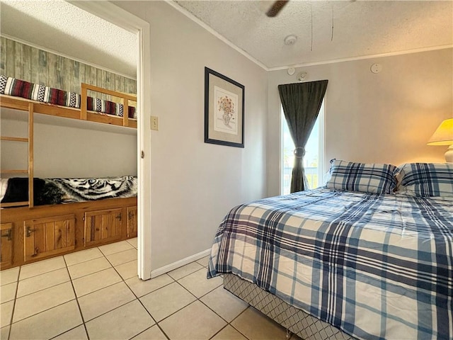 3938 Surfside Unit 3337, Corpus Christi, TX 78402 - tiled bedroom with a textured ceiling and crown molding