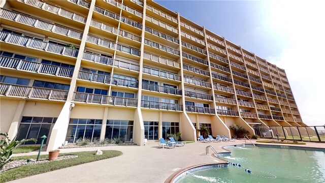 view of pool featuring a patio