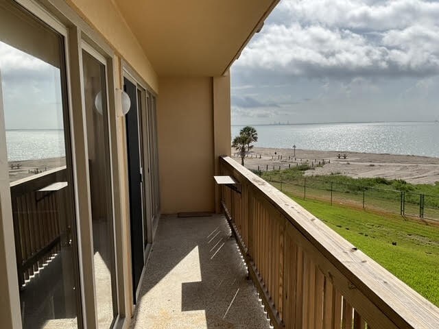 balcony featuring a water view