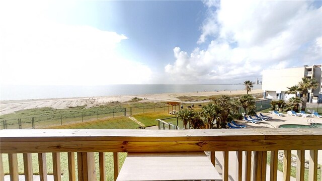 wooden terrace with a rural view and a community pool