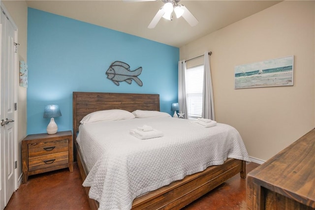 bedroom featuring dark colored carpet and ceiling fan