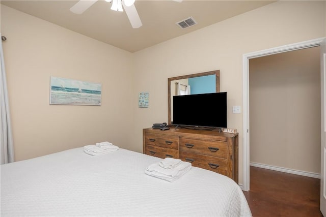 bedroom with ceiling fan and dark carpet