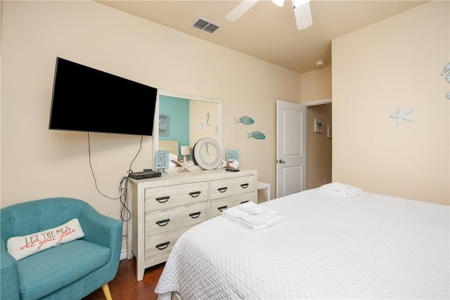 bedroom with ceiling fan and dark hardwood / wood-style floors