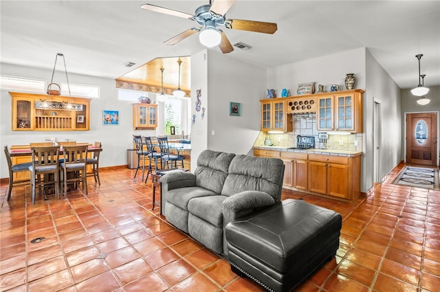 living room featuring light tile patterned floors and ceiling fan