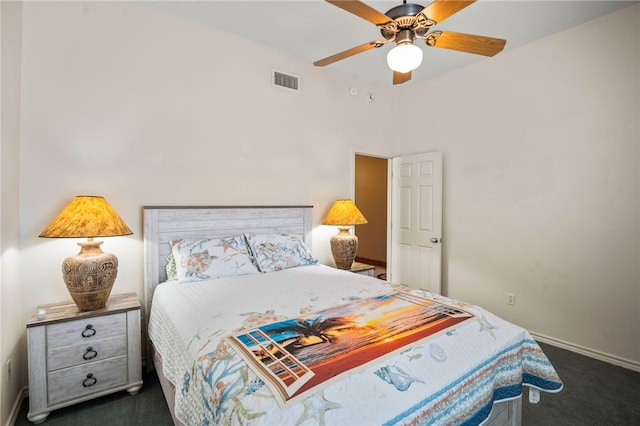 bedroom with dark colored carpet and ceiling fan