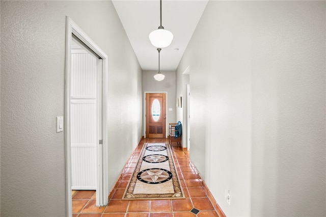 15746 Cuttysark St, Corpus Christi, TX 78418 - doorway with inlaid floor details, tile patterned flooring, and baseboards