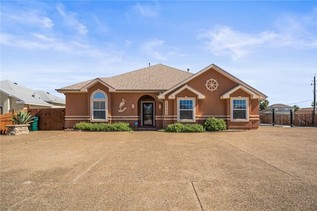 15746 Cuttysark St, Corpus Christi, TX 78418 - view of front of property with stucco siding, a gate, and a shingled roof
