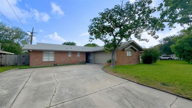 134 Daniel Moore St, Portland, TX 78374 - ranch-style house featuring brick siding, a garage, and driveway
