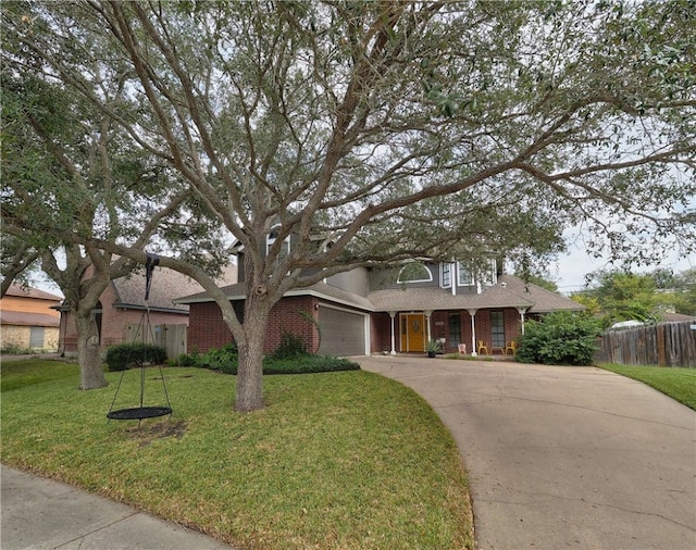 view of front of home featuring a garage and a front yard