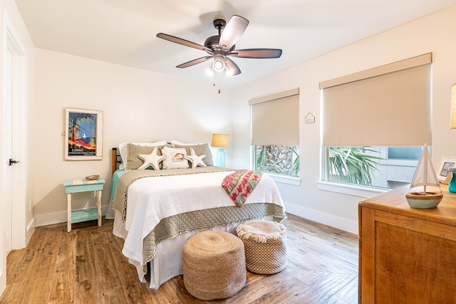 bedroom featuring hardwood / wood-style flooring and ceiling fan