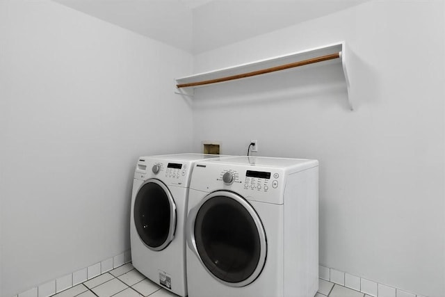521 Del Mar Blvd, Corpus Christi, TX 78404 - washroom featuring washer and dryer and light tile patterned flooring