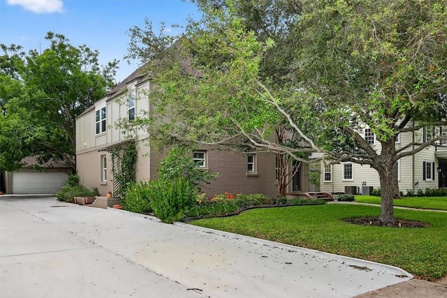 521 Del Mar Blvd, Corpus Christi, TX 78404 - view of front of property with a front lawn, an outdoor structure, driveway, and stucco siding