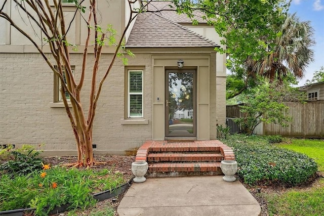521 Del Mar Blvd, Corpus Christi, TX 78404 - doorway to property with brick siding and a shingled roof