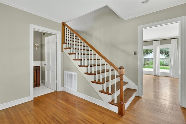 521 Del Mar Blvd, Corpus Christi, TX 78404 - staircase featuring crown molding and wood finished floors