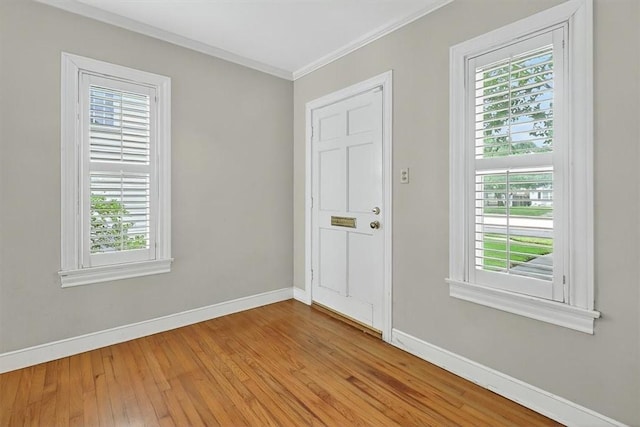 521 Del Mar Blvd, Corpus Christi, TX 78404 - entrance foyer with plenty of natural light, crown molding, and hardwood / wood-style floors
