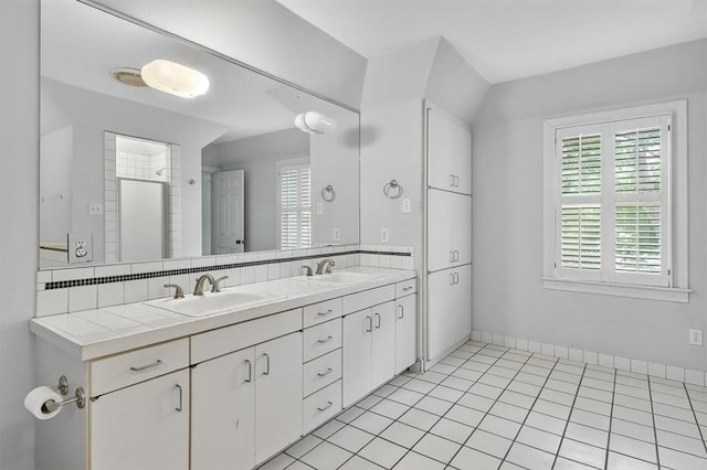 521 Del Mar Blvd, Corpus Christi, TX 78404 - full bathroom with double vanity and healthy amount of natural light