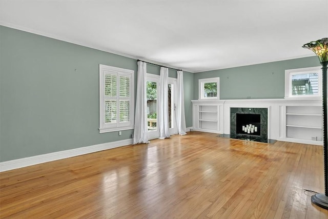 521 Del Mar Blvd, Corpus Christi, TX 78404 - unfurnished living room with wood-type flooring, a fireplace, and ornamental molding