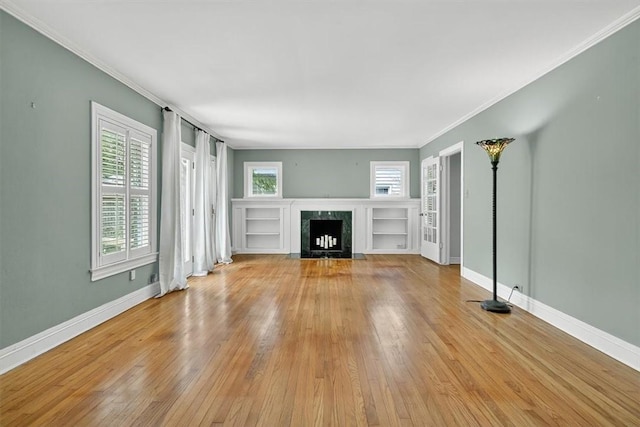 521 Del Mar Blvd, Corpus Christi, TX 78404 - unfurnished living room featuring hardwood / wood-style flooring, a fireplace with flush hearth, and ornamental molding