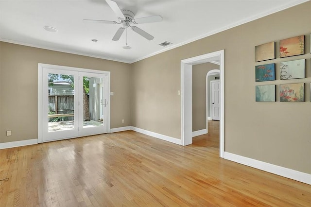 521 Del Mar Blvd, Corpus Christi, TX 78404 - spare room featuring ornamental molding, arched walkways, light wood-type flooring, and ceiling fan