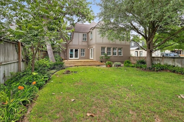 521 Del Mar Blvd, Corpus Christi, TX 78404 - rear view of house featuring a fenced backyard, stucco siding, and a wooden deck