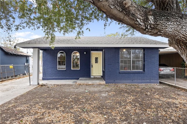 3033 Elgin St, Corpus Christi, TX 78405 - ranch-style house featuring brick siding, roof with shingles, and a porch