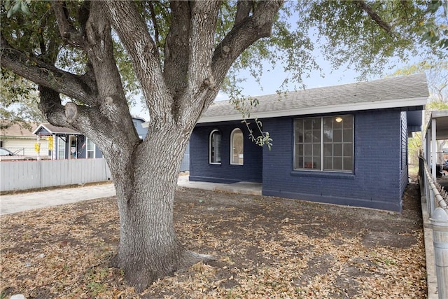 3033 Elgin St, Corpus Christi, TX 78405 - view of front facade with brick siding and roof with shingles