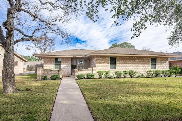 ranch-style house with a front lawn