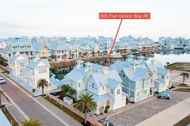 bird's eye view featuring a residential view and a water view