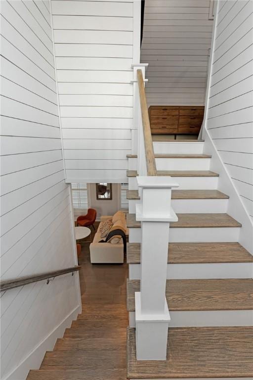 staircase featuring wood finished floors