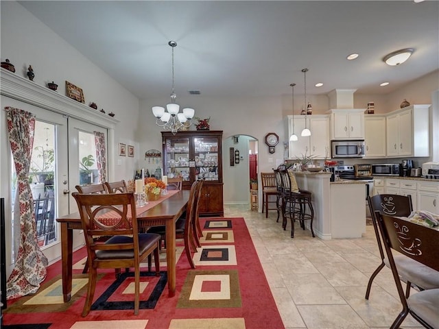 13838 Sea Horse Ave, Corpus Christi, TX 78418 - dining space featuring a chandelier, light tile patterned floors, recessed lighting, and french doors