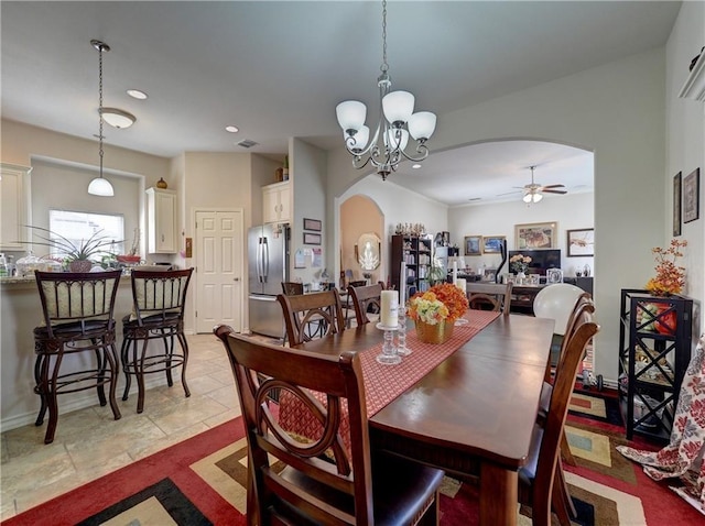 13838 Sea Horse Ave, Corpus Christi, TX 78418 - dining area with arched walkways, ceiling fan, a chandelier, and recessed lighting