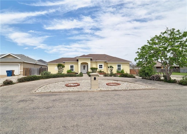 13838 Sea Horse Ave, Corpus Christi, TX 78418 - view of front of house featuring curved driveway and stucco siding