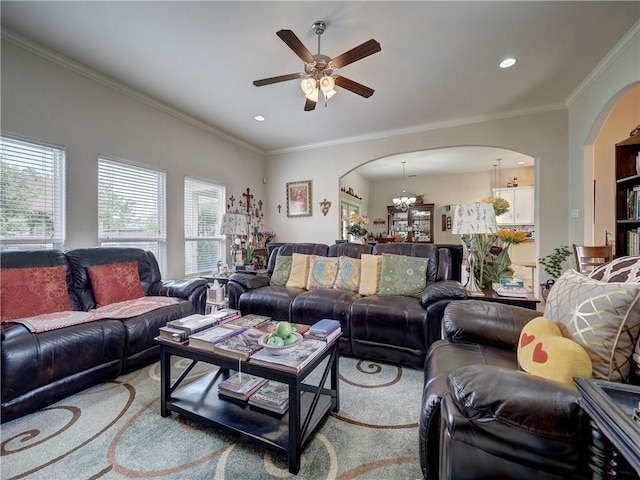 13838 Sea Horse Ave, Corpus Christi, TX 78418 - living room featuring arched walkways, plenty of natural light, a ceiling fan, crown molding, and a chandelier
