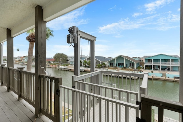 exterior space with a residential view and a water view