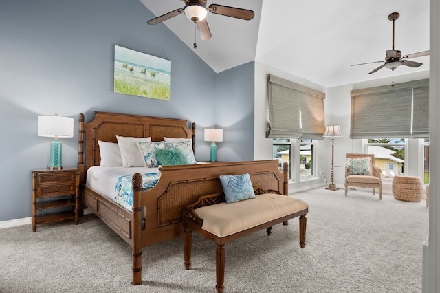 carpeted bedroom with high vaulted ceiling, baseboards, and a ceiling fan